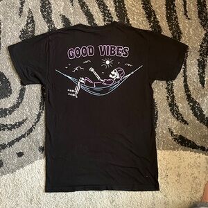 Black Graphic Tee with Relaxing Skeleton